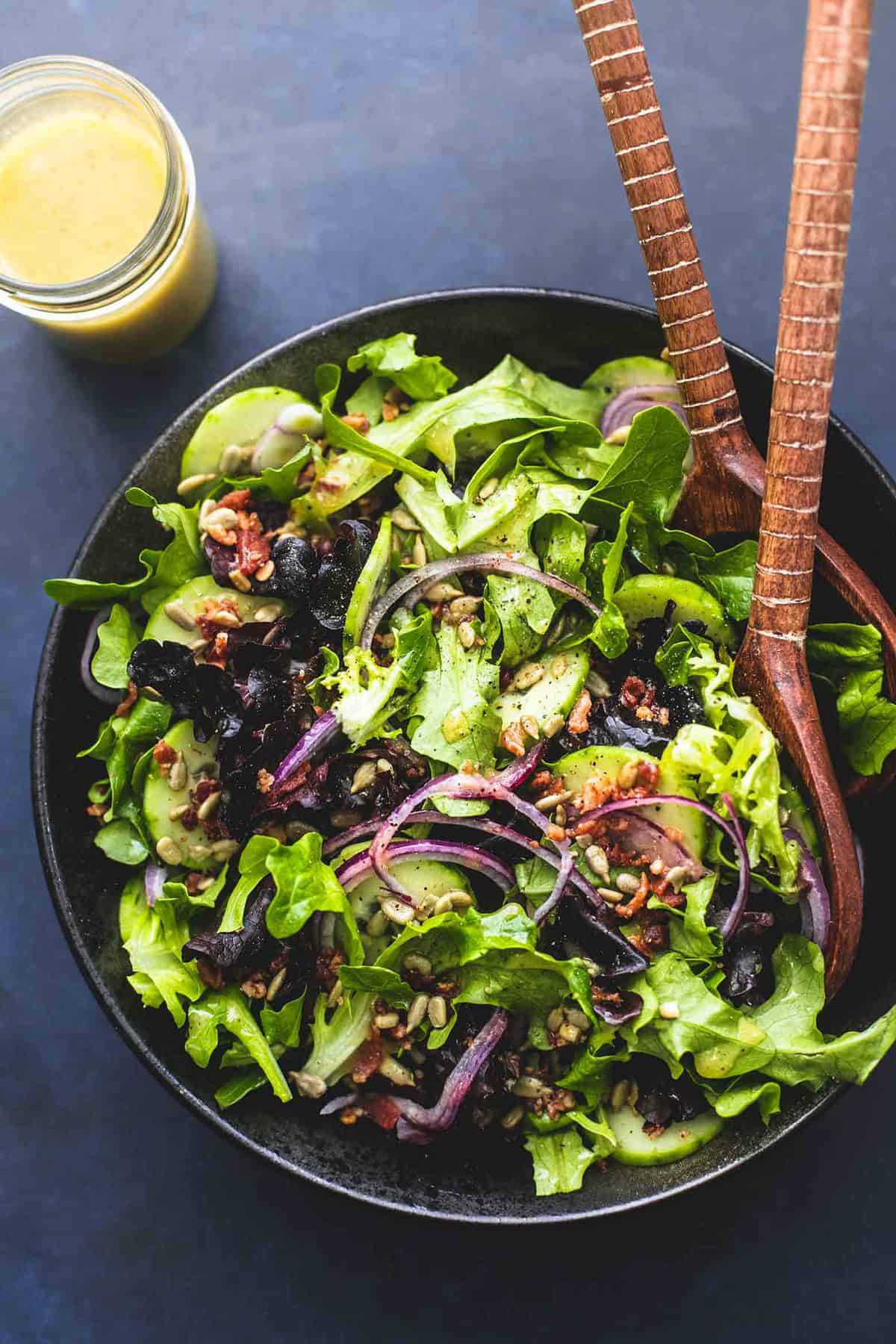 Best Simple Tossed Green Salad is the easiest side dish and goes perfectly with just about anything! Totally customizable and tossed in the tastiest 6-ingredient homemade dressing! | lecremedelacrumb.com