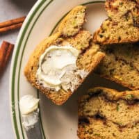 piece of cinnamon zucchini bread with butter smeared