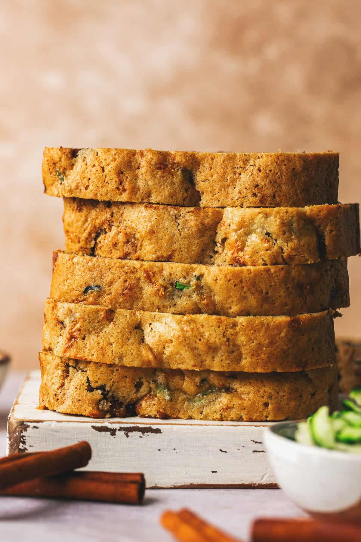 stack of sliced zucchini bread on cutting board