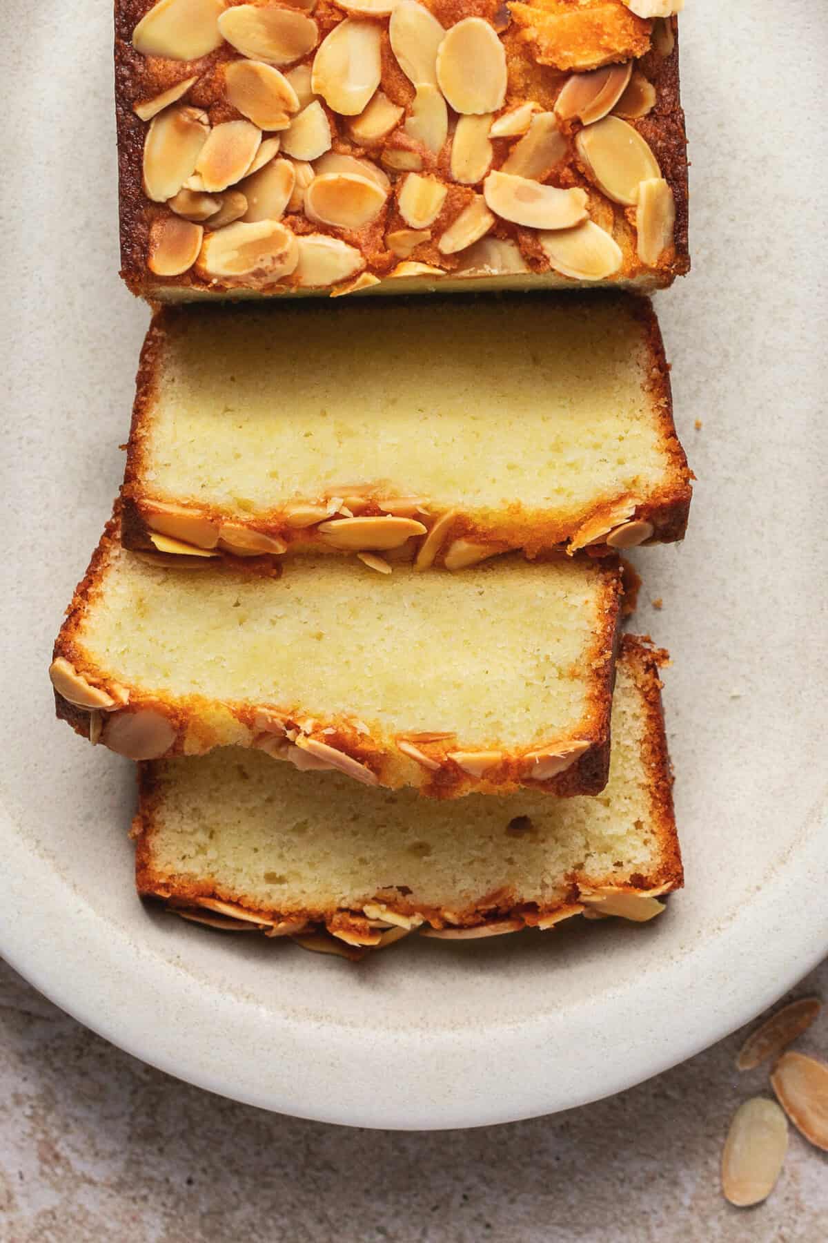 sliced almond cake on platter