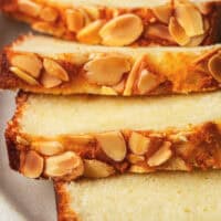 sliced almond cake with slivered almonds on top