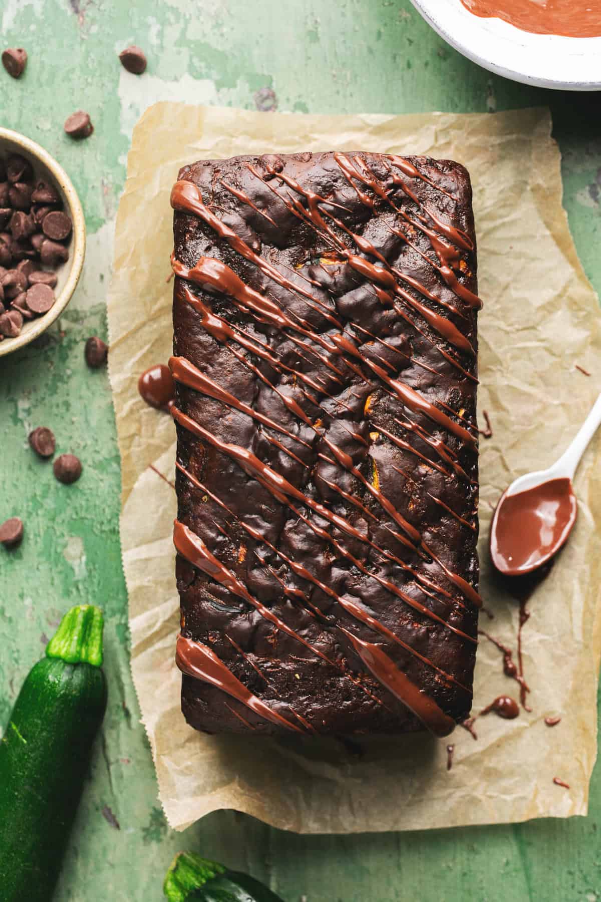 loaf of chocolate zucchini bread on parchment paper