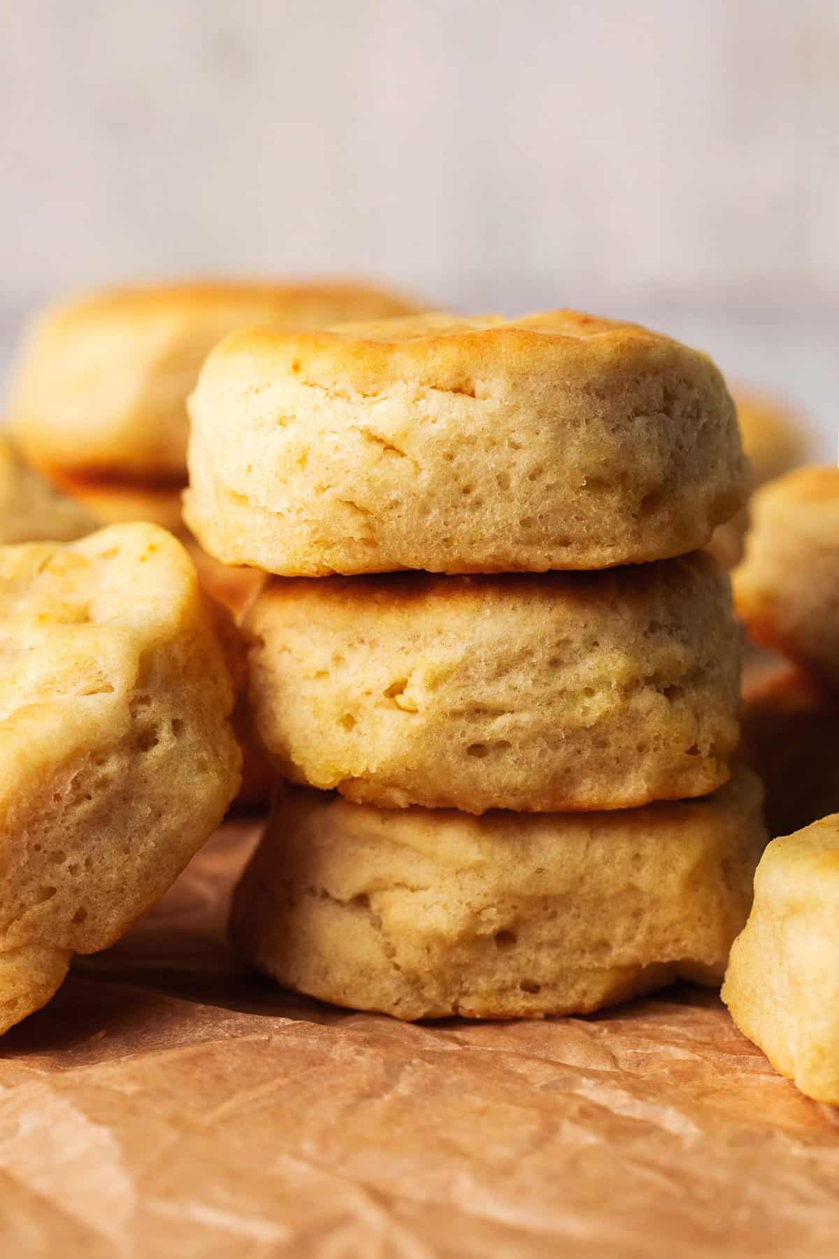 stack of three biscuits on parchment paper