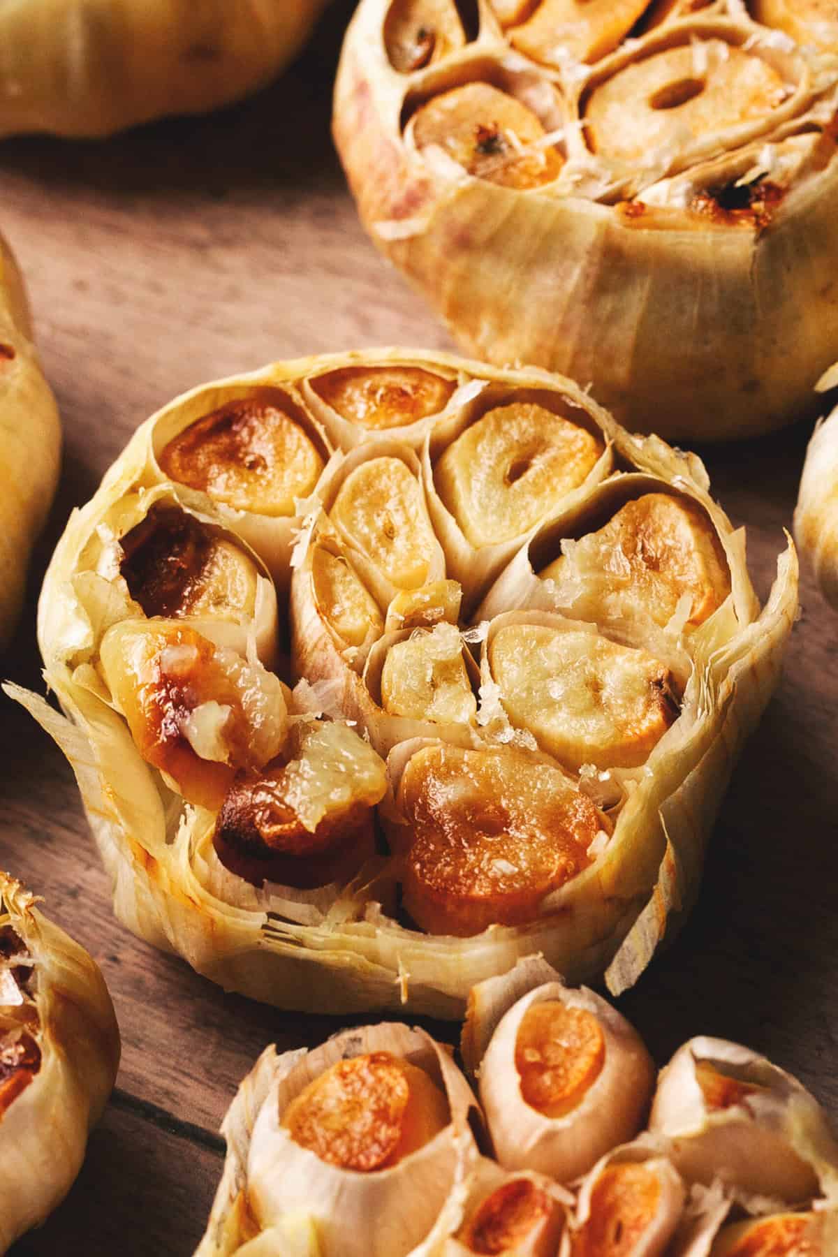 up close view of roasted garlic inside husk