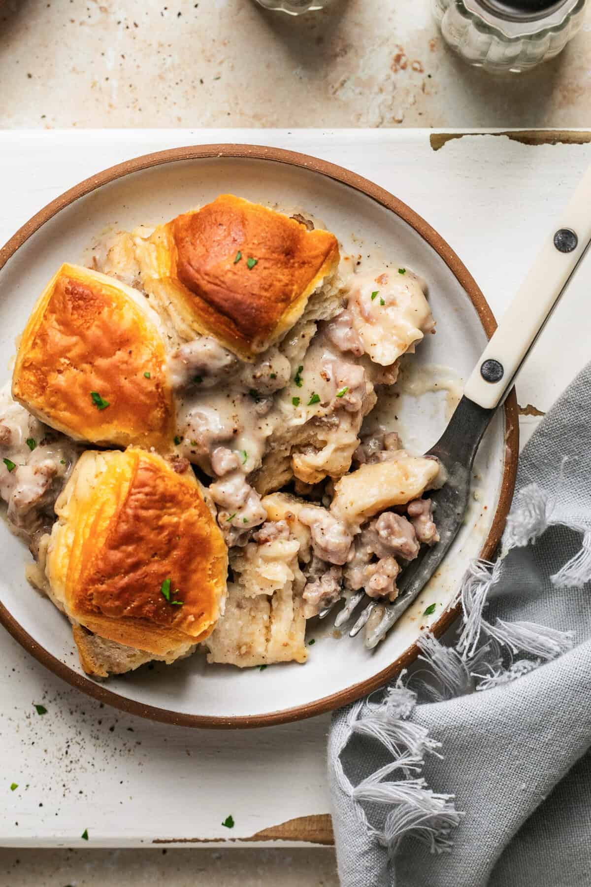 overhead view biscuits and sausage gravy casserole on plate