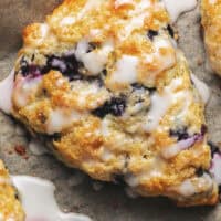 overhead view of one glazed blueberry scone