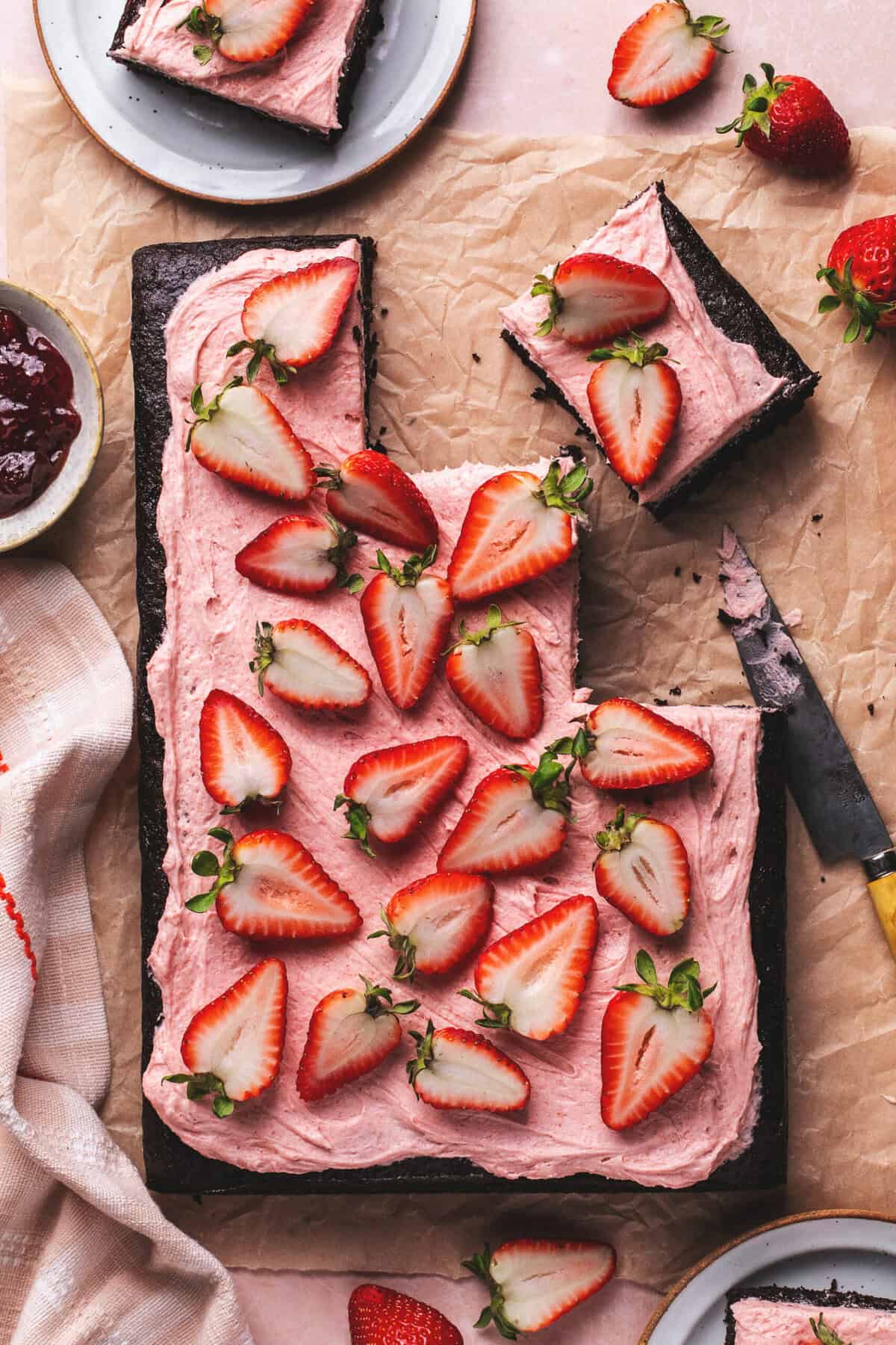 chocolate sheet cake with a few slices cut out