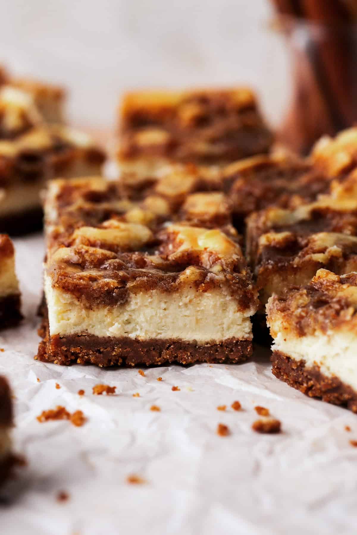 side view of sliced cheesecake bars with cinnamon swirl