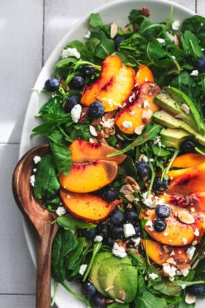 nectarine peach blueberry salad with almonds, blueberries, and balsamic dressing on plate