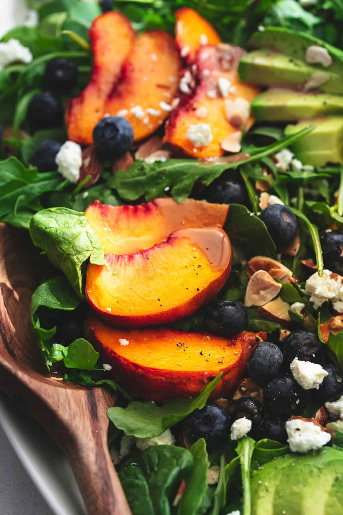 up close view of peaches, lettuce, blueberries, almonds