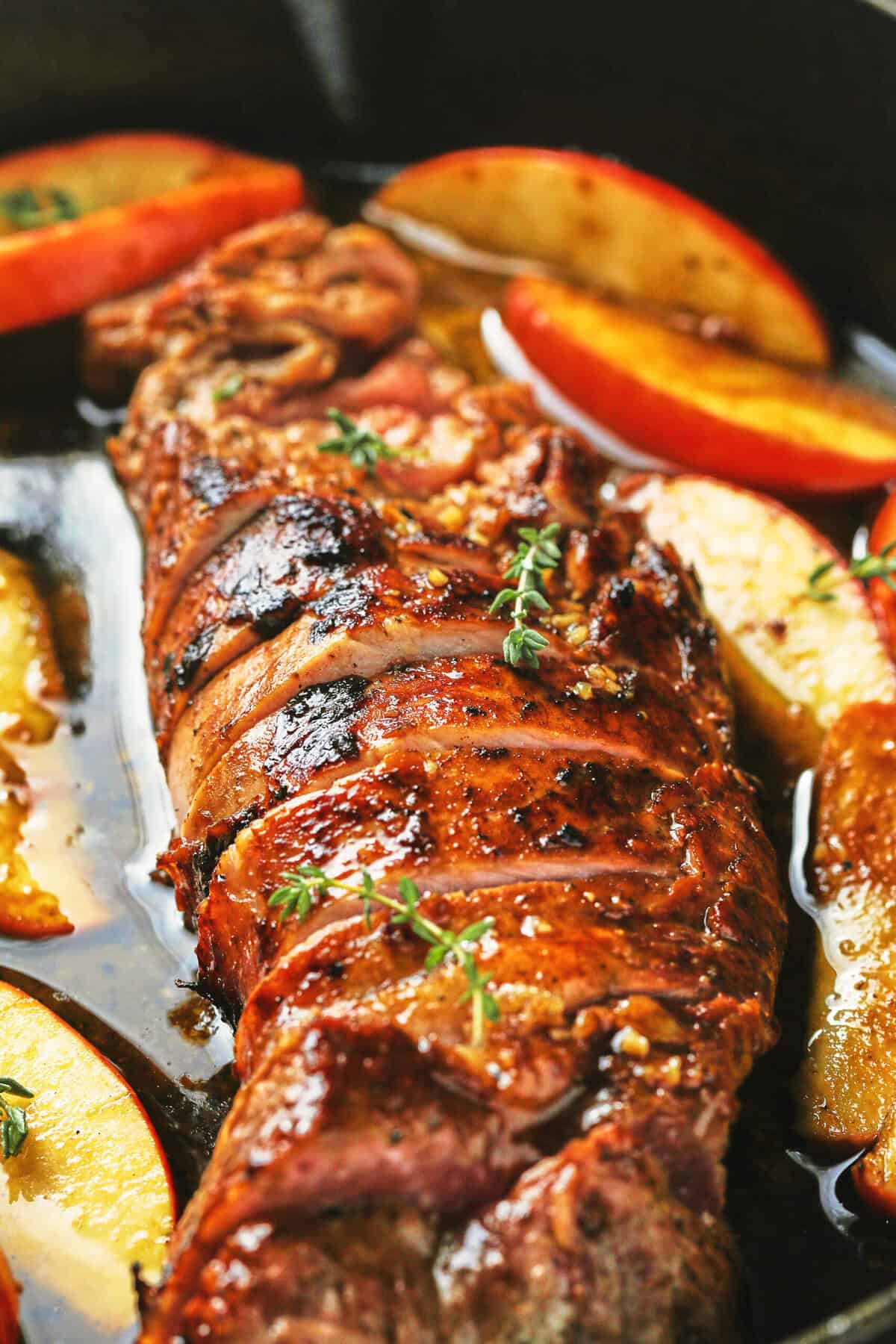 pork tenderloin with glaze and apples up close