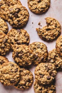 overhead view of lots of chocolate chip and oatmeal cookies on tabletop