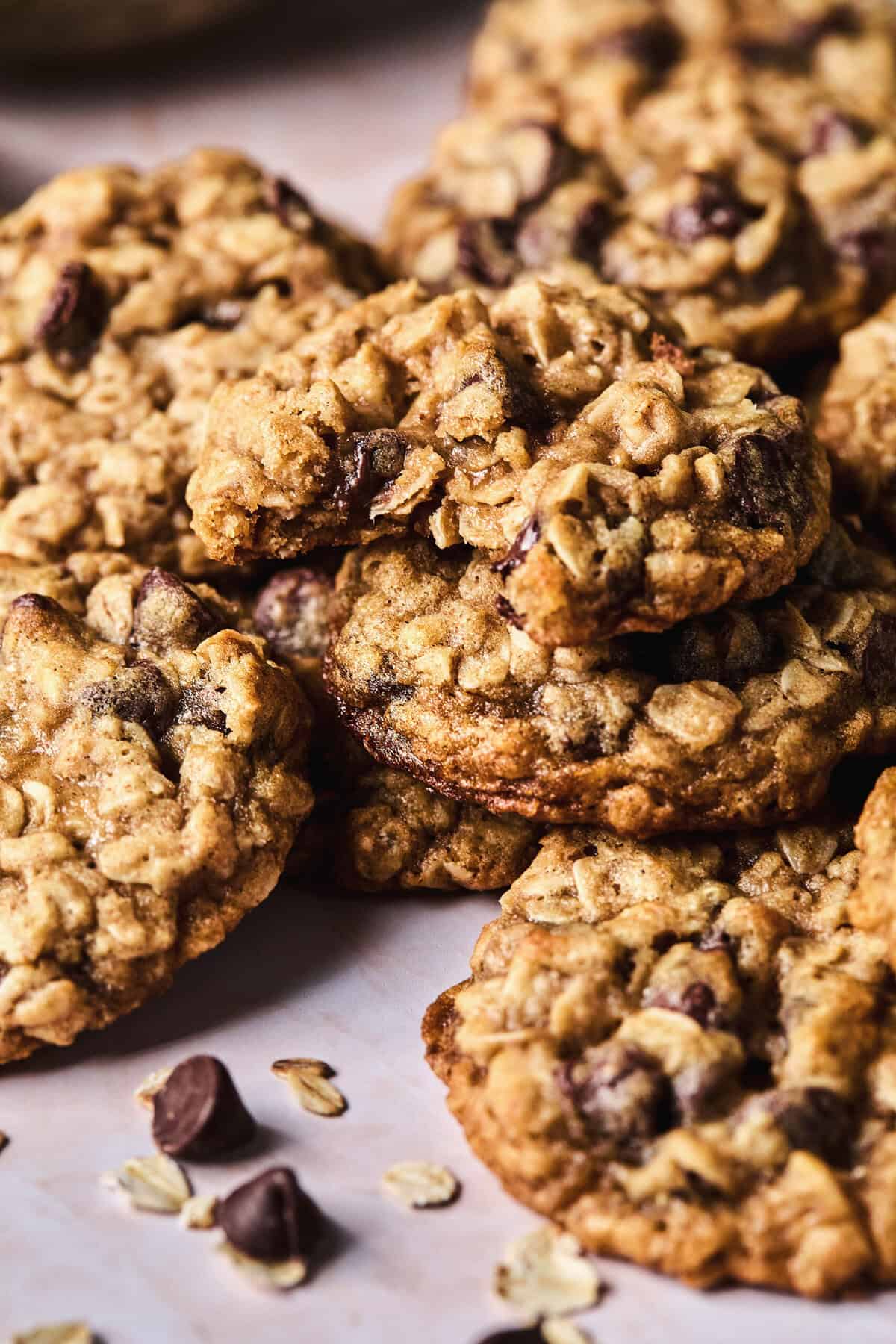 pile of cookies with oatmeal and chocolate chips on table