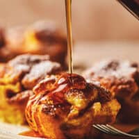 syrup pouring onto french toast muffin