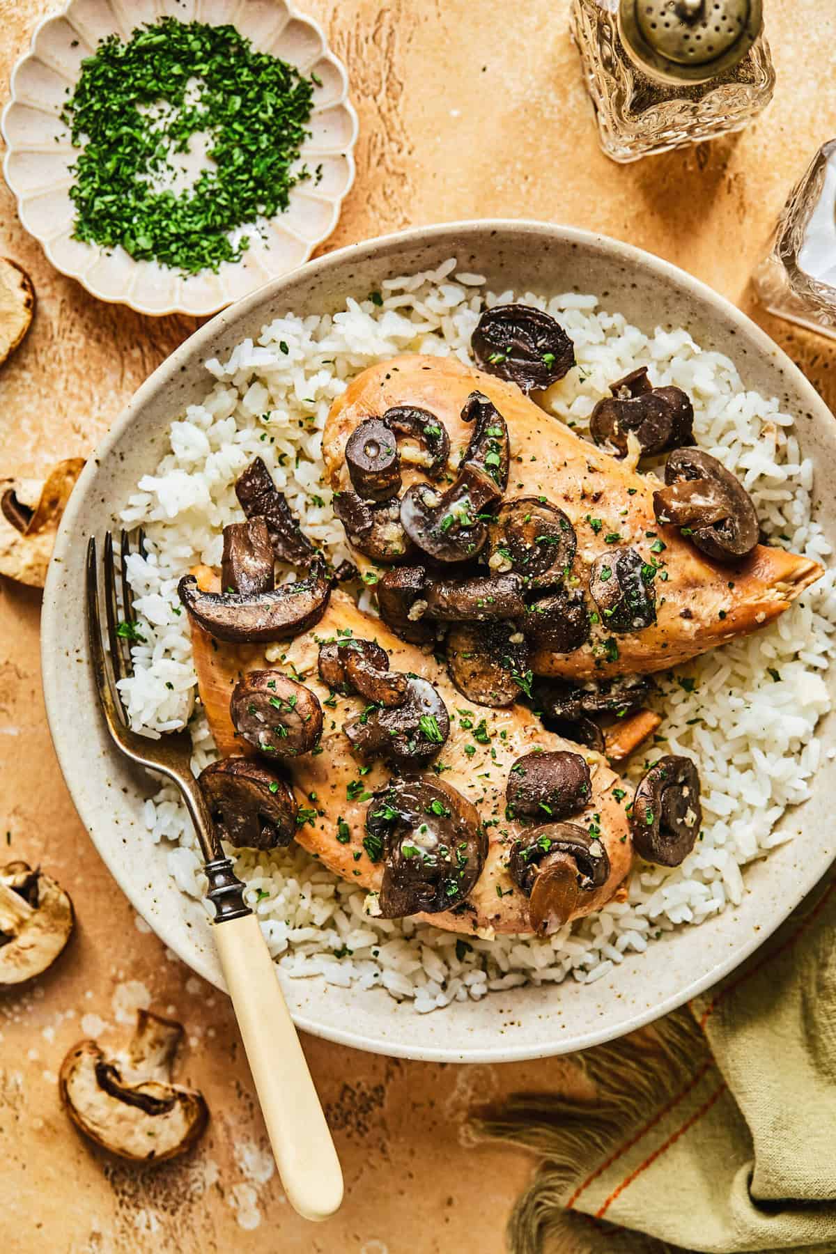 crockpot chicken marsala over rice on plate with fork