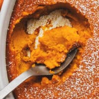 overhead view closeup of spoon scooping mashed carrots