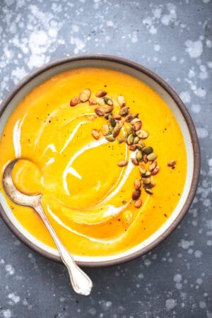 bowl of butternut squash soup topped with roasted pepitas